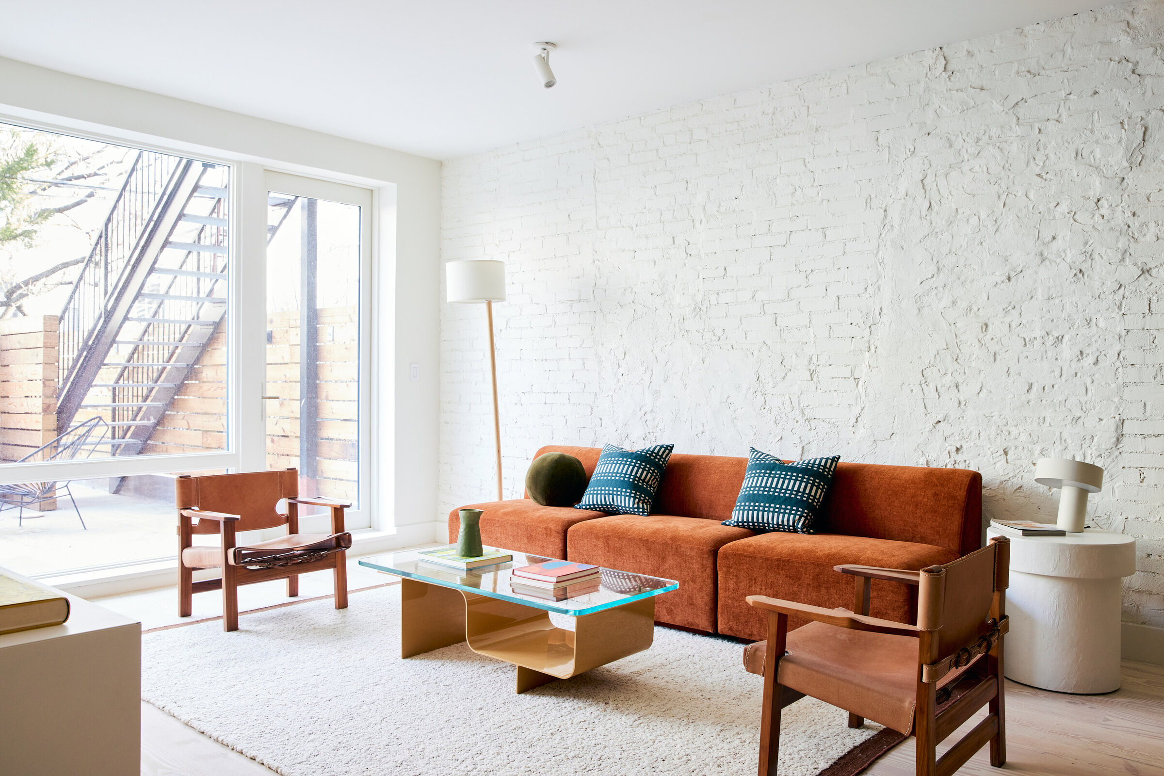 Living room with white-painted brick at 239 President Street