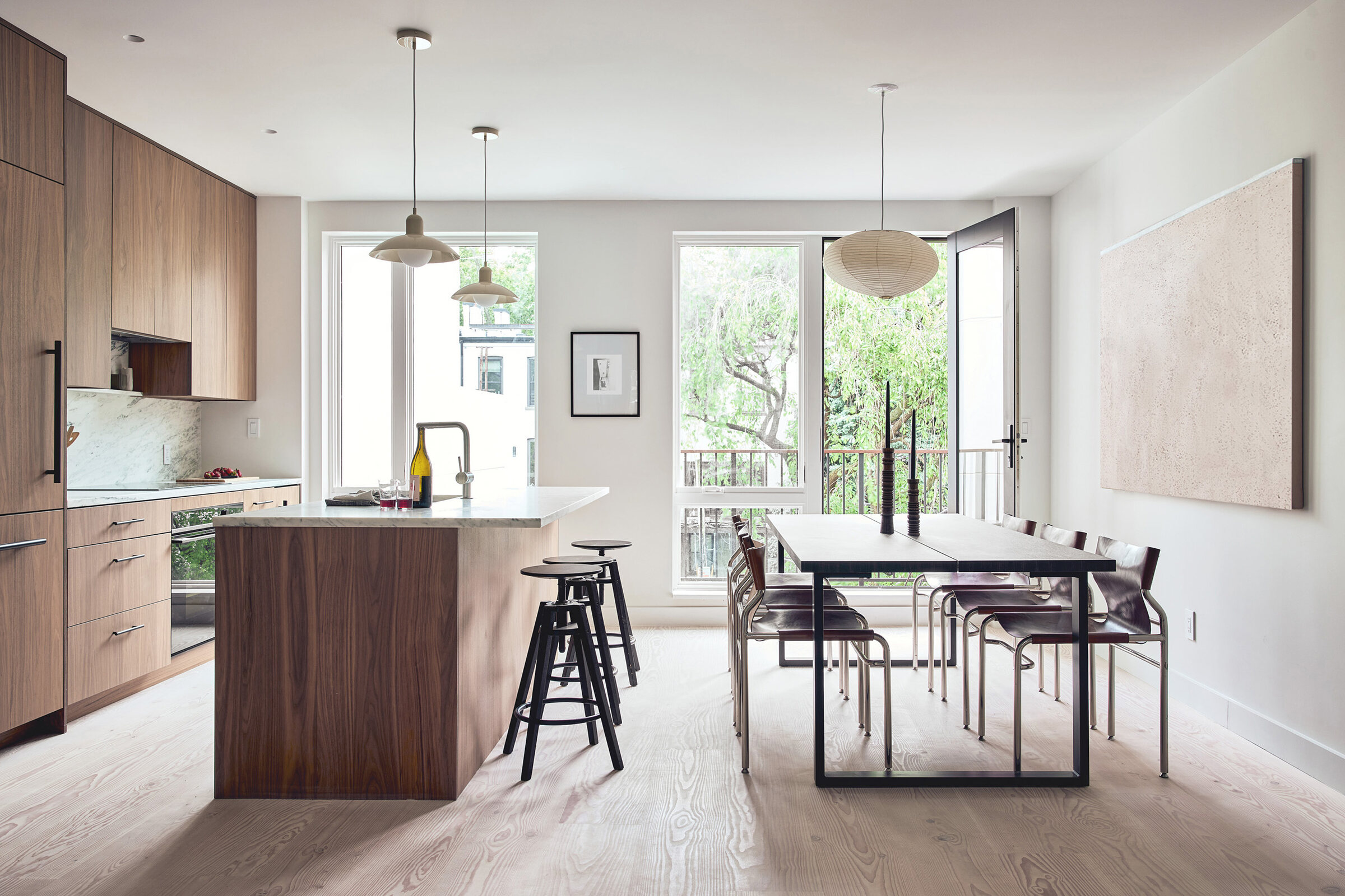 Walnut kitchen and dining area opening to the terrace at 42 Garfield Place